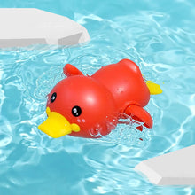 Load image into Gallery viewer, Red rubber duck floating in a pool with blue water.