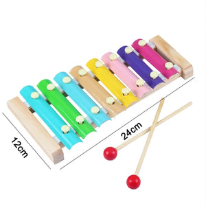 Colorful wooden xylophone with measurement details on a white background