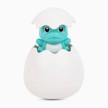 Load image into Gallery viewer, Toy frog emerging from a white egg on a white background