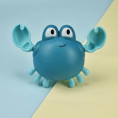 Blue crab-shaped toy on a two-tone blue and yellow background