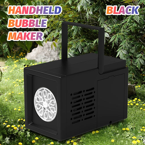 Black handheld bubble maker with grass and flowers in the background