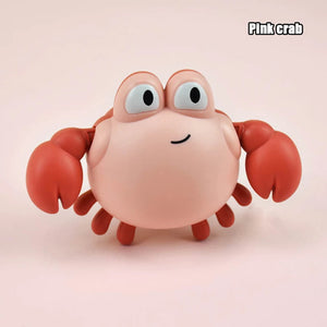 Pink crab toy with a plain background